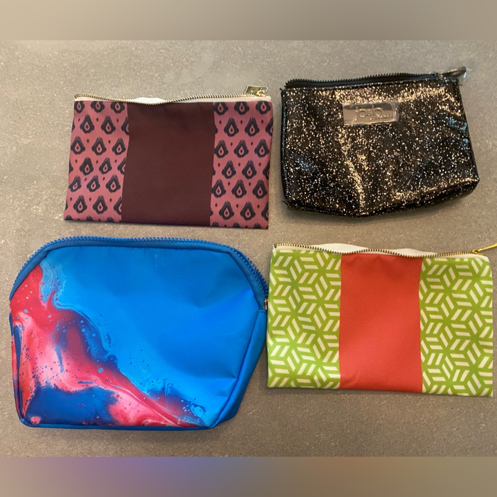 Brand new set of 4 Cosmetic Bags